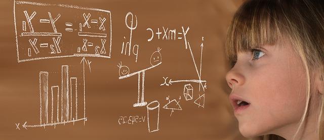 child looking at math formulas